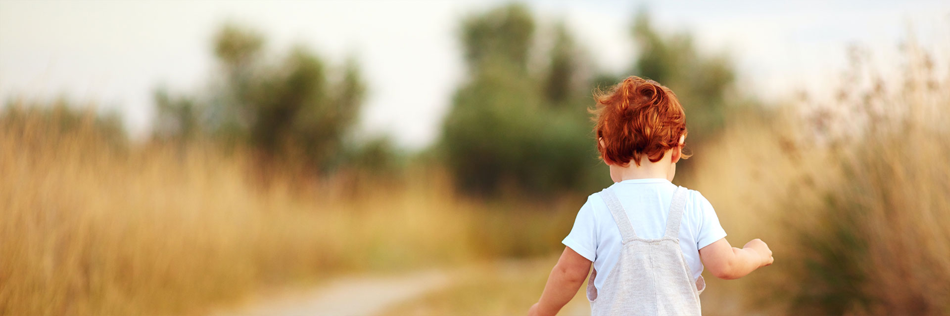 Small child walking along a path