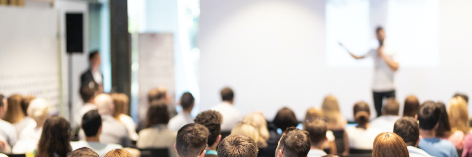 Audience listening to a speaker presentation